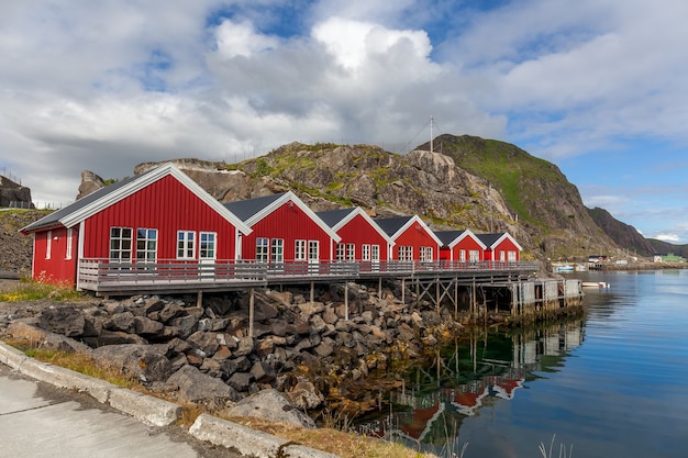 Typical norwegian village on the fjord. reflection in water