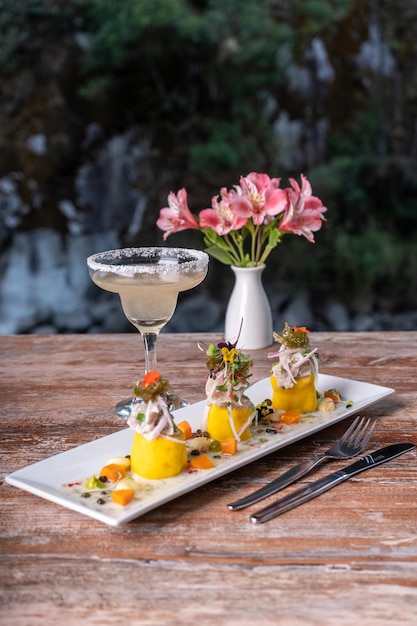 Typical Peruvian dish, Causa Rellena at a restaurant table.