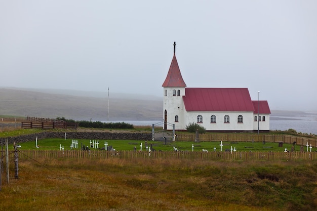 Typical Rural Icelandic church with local cemetery