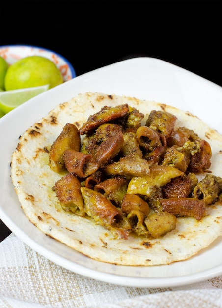 Typical and traditional food from Colombia and Mexico Chunchurria with arepacorn tortilla