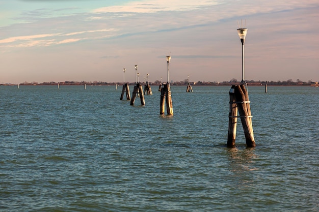 Typical wooden poles in a Venetian lagoon