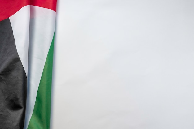 UAE flag on a white background with space for text on the right