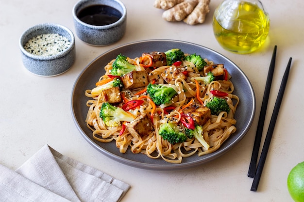 Udon noodles with tofu broccoli carrots pepper and sesame Healthy eating Vegetarian food Asian food