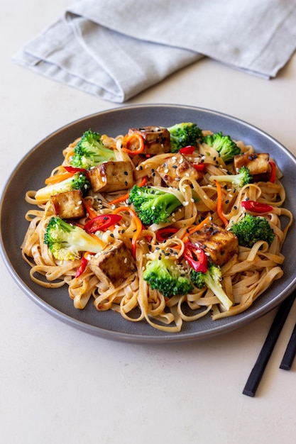 Udon noodles with tofu broccoli carrots pepper and sesame Healthy eating Vegetarian food Asian food