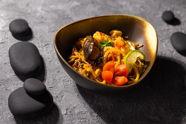 Udon stirfry noodles with mussels and shrimp Asian cuisine