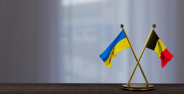 Photo ukraine and belgium flags on table negotiation between belgium and ukraine