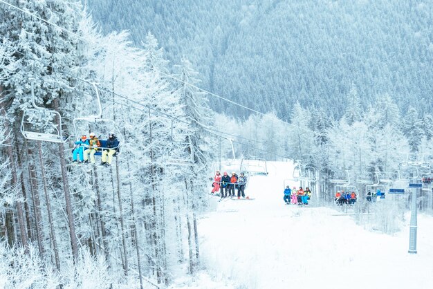 Ukraine bukovel December 17 2017 skier lift up by snowed carpathian mountains