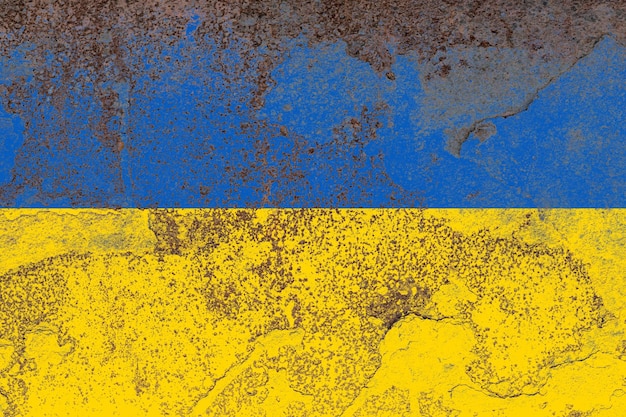 Ukraine flag on a rusty old iron metal sheet