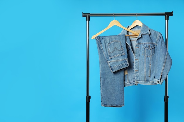 Ukraine Kyiv 28102023 Jeans hang on hangers on a blue background