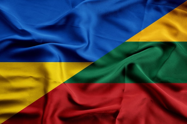 Ukraine and lithuania two flag together fabric texture background