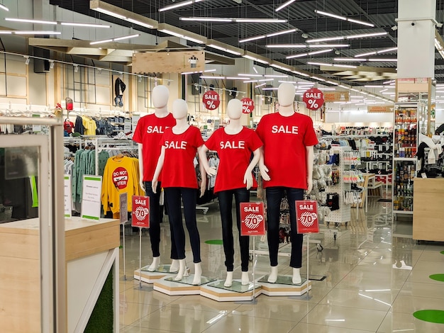 Ukraine Vinnitsa August 11 2020 mannequin wearing sale letter on red t shirt in shopping department store retail business background