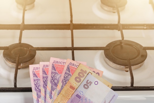 Ukrainian bills of different value near the gas stove