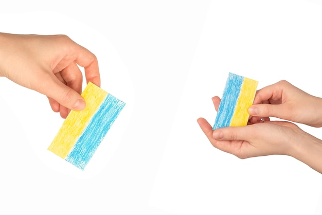 Ukrainian flag in woman hands isolated on a white background