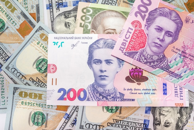 Ukrainian hryvnia, American dollars new banknotes. Close-up. Financial background. Money background. Exchange concept