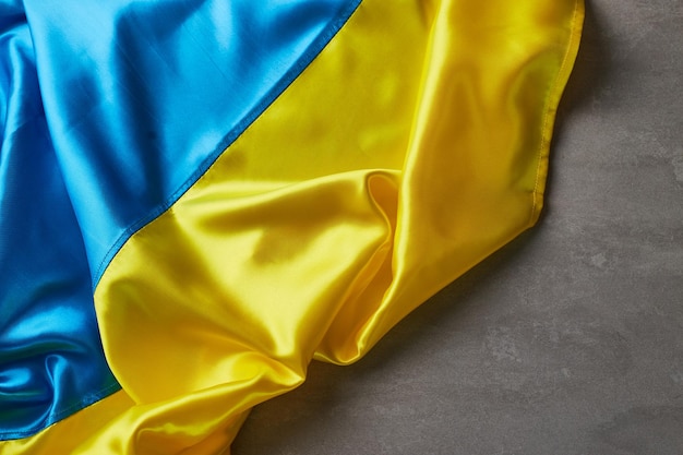 Ukrainian national flag colors on beton background Yellow and blue colors Ukraine nation independence celebration symbol