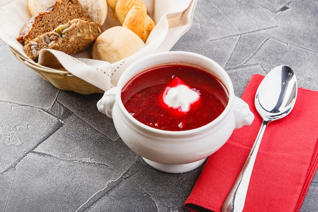 Ukrainian and Russian national red borsch with sour cream and herbs