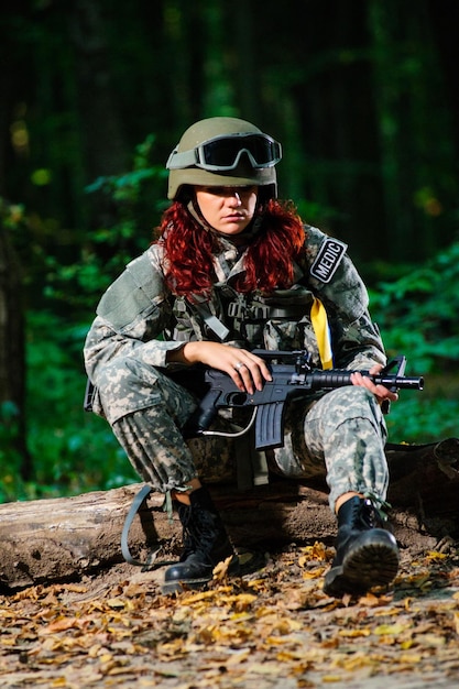 Ukranian female soldier in the forest