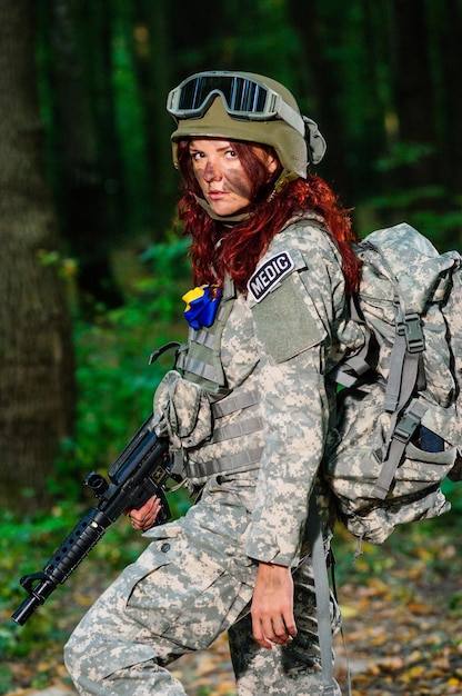 Ukranian female soldier in the forest