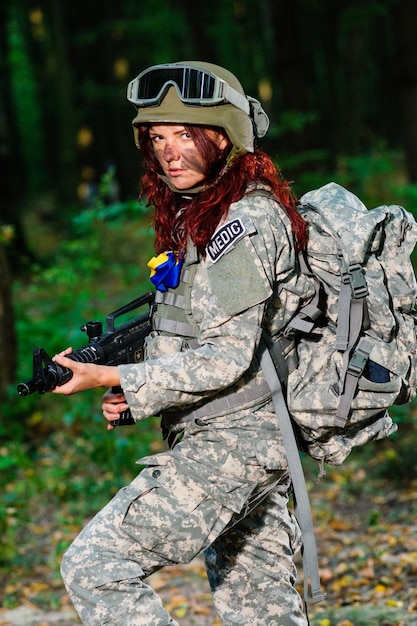 Ukranian female soldier in the forest