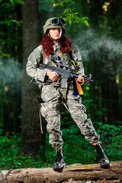 Ukranian female soldier in the forest