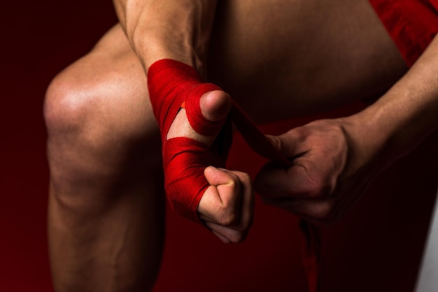 Ultimate Fighter Putting Straps On His Hands