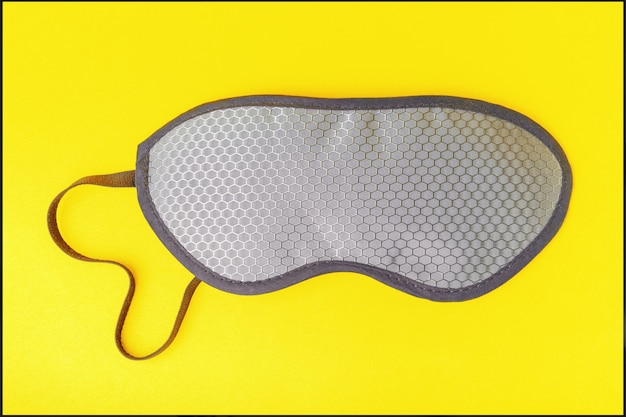 Ultimate grey sleep mask over illuminating yellow color