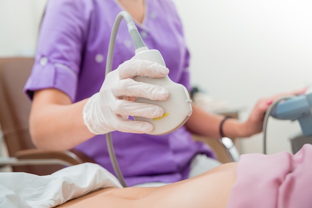 Ultrasound scanner in the hands of a doctor.