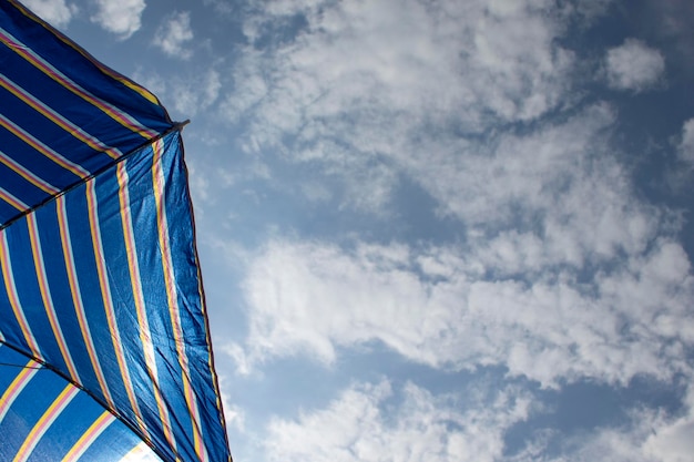 Umbrella beach Selective focus of a beach umbrella in front of the sky Vacation concept