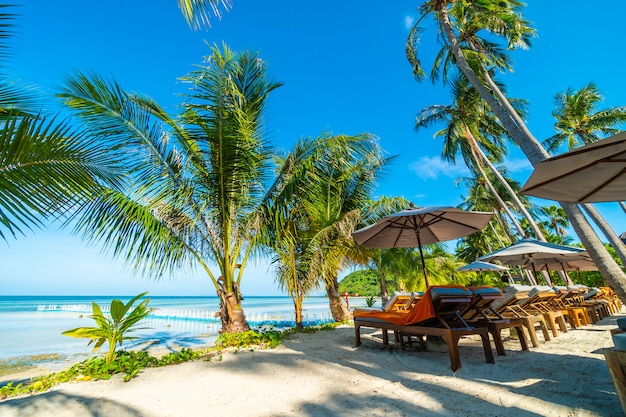 Umbrella and chair around beach and sea for travel and vacation