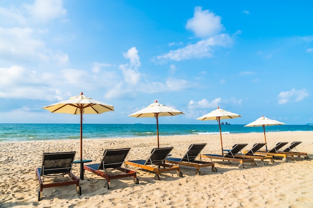 Umbrella and chair on the beach and sea