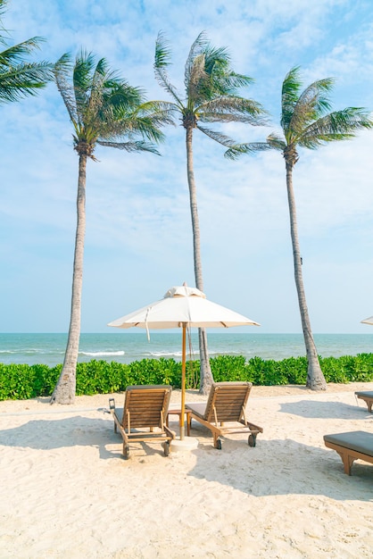 umbrella with beach chair and ocean sea background - holiday and vacation concept