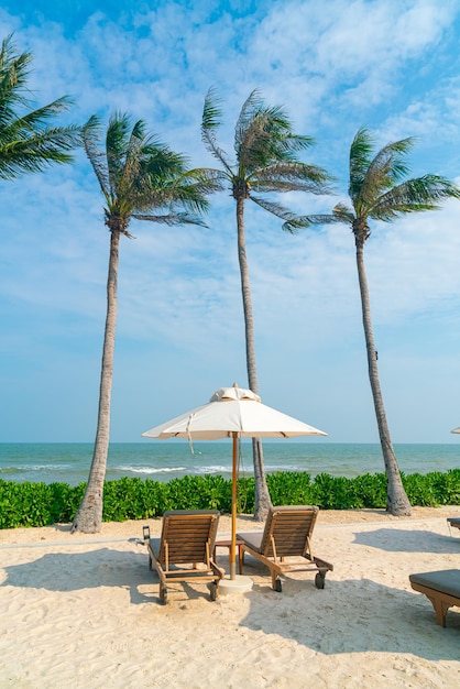 umbrella with beach chair and ocean sea background - holiday and vacation concept