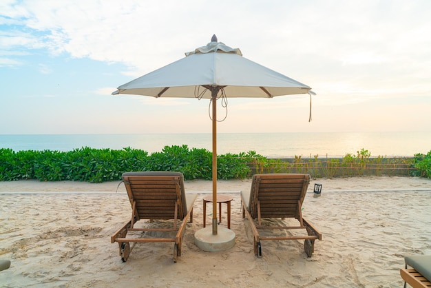 umbrella with beach chair and ocean sea background - holiday and vacation concept