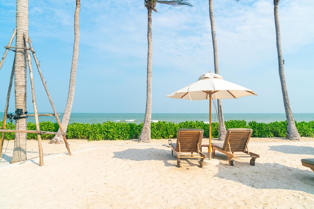 Umbrella with beach chair and ocean sea background