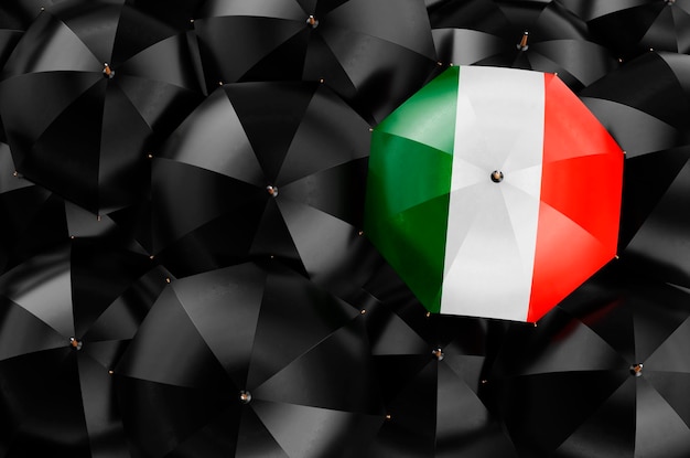 Umbrella with Irish flag among black umbrellas 3D rendering