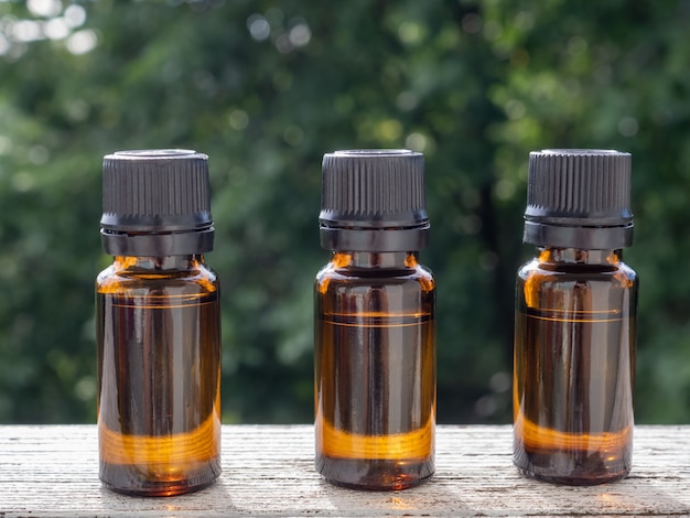 Unbranded amber bottles set for cosmetics, natural medicine, essential, massage oils or other liquids.