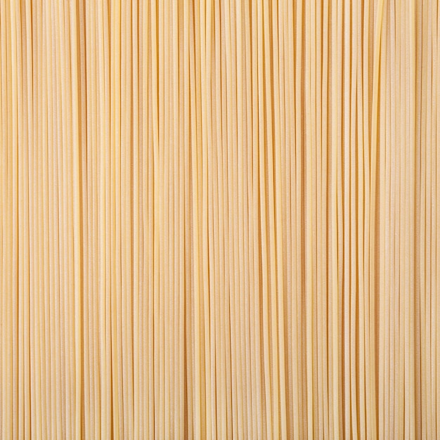 Uncooked dried spaghetti pasta background