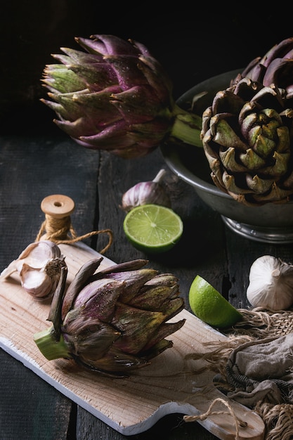 Uncooked purple artichokes