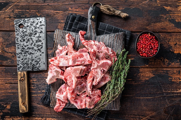 Uncooked Raw meat diced for stew on a butcher board