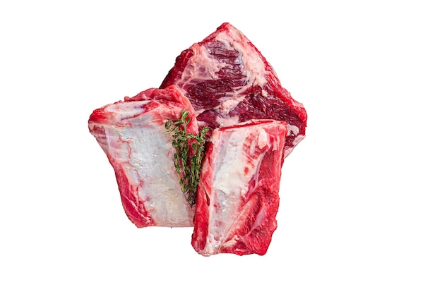 Uncooked Raw veal Short Ribs on rustic plate with rosemary Dark background Top view