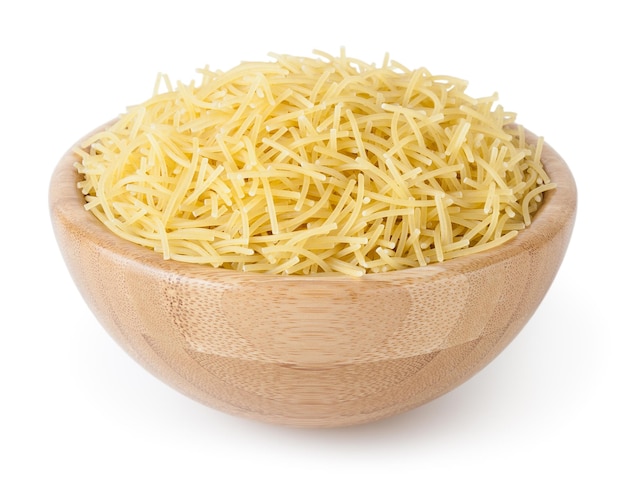 Uncooked vermicelli pasta in wooden bowl isolated on white background with clipping path