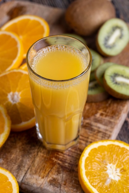 Uncut orange on a wooden chopping board