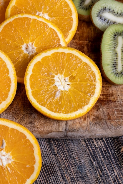 Uncut orange on a wooden chopping board