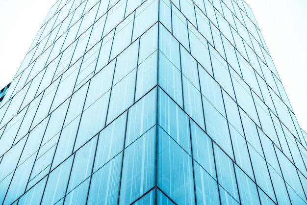 Underside panoramic and perspective view to steel blue glass high rise building skyscrapers business concept of successful industrial architecture