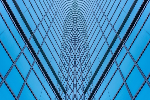 Underside panoramic and perspective view to steel blue glass high rise building skyscrapers business concept of successful industrial architecture