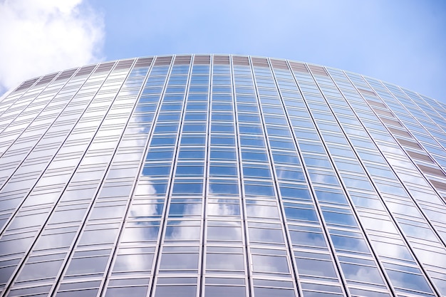 Underside panoramic and perspective view to steel blue glass high rise building skyscrapers, business concept of successful industrial architecture