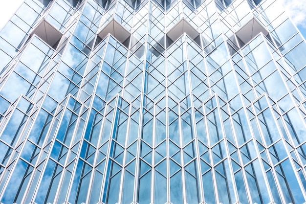 Underside panoramic and perspective view to steel blue glass high rise building skyscrapers, business concept of successful industrial architecture