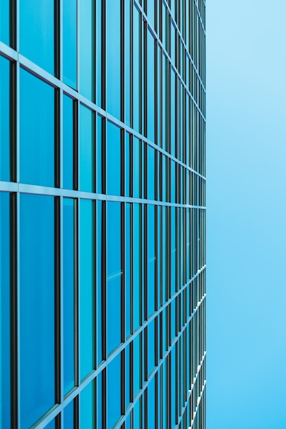 Underside panoramic and perspective view to steel blue glass high rise building skyscrapers