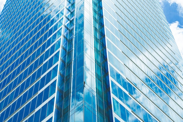 Underside panoramic and perspective view to steel blue glass high rise building skyscrapers