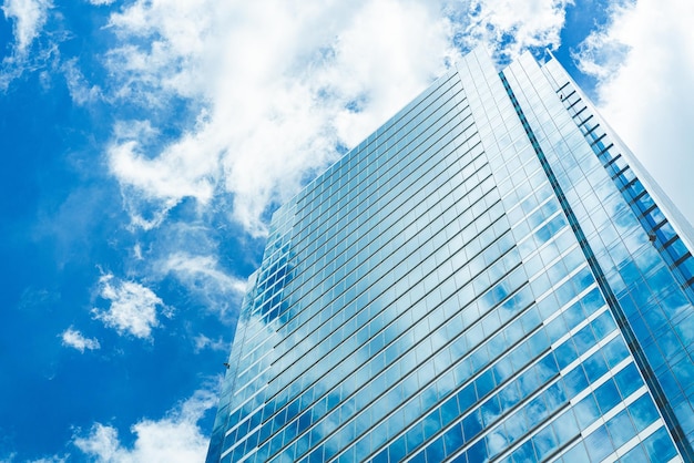 Underside panoramic and perspective view to steel blue glass high rise building skyscrapers